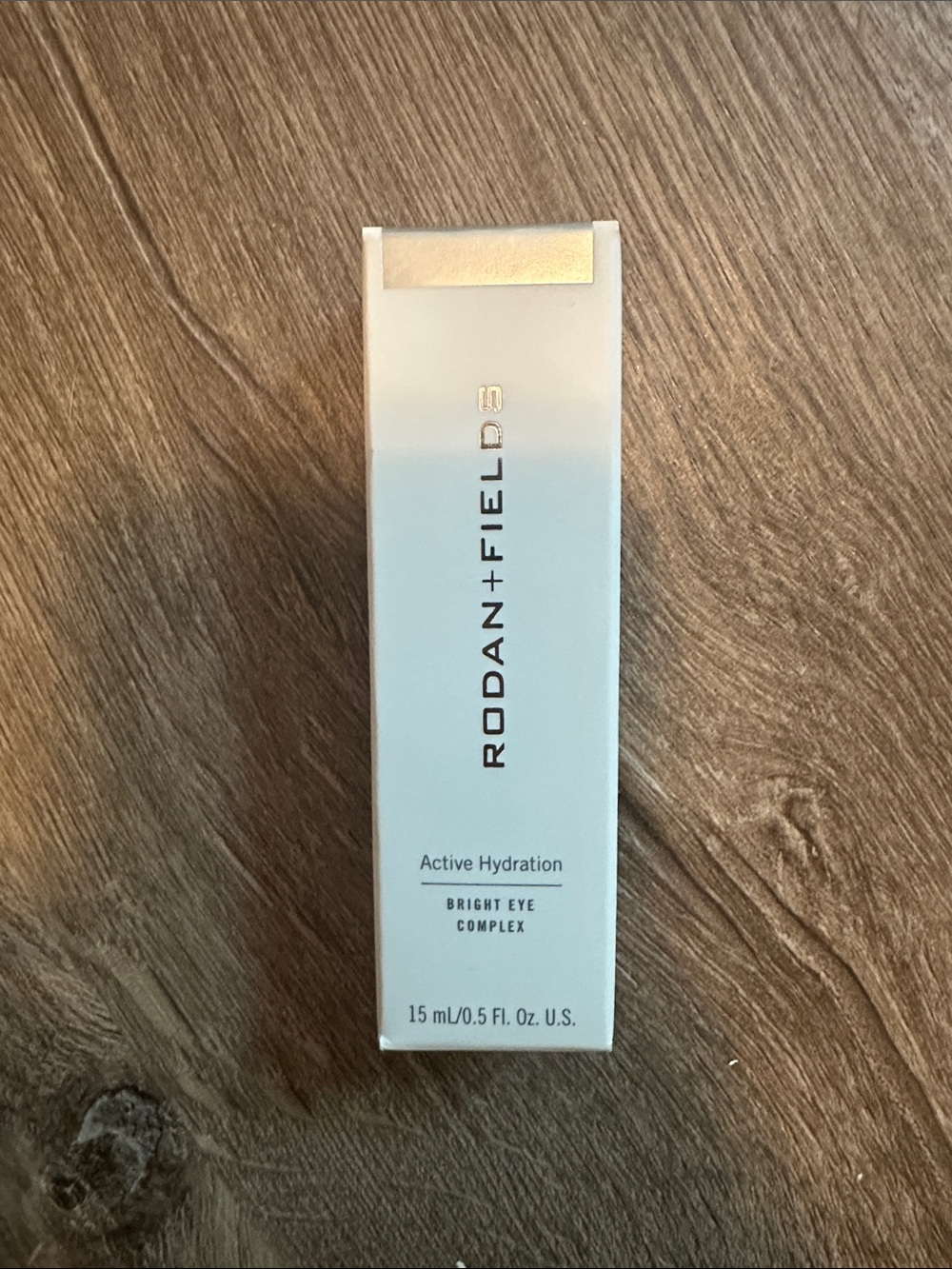 Rodan + Fields Bright Eye Complex – White and Gold Accents